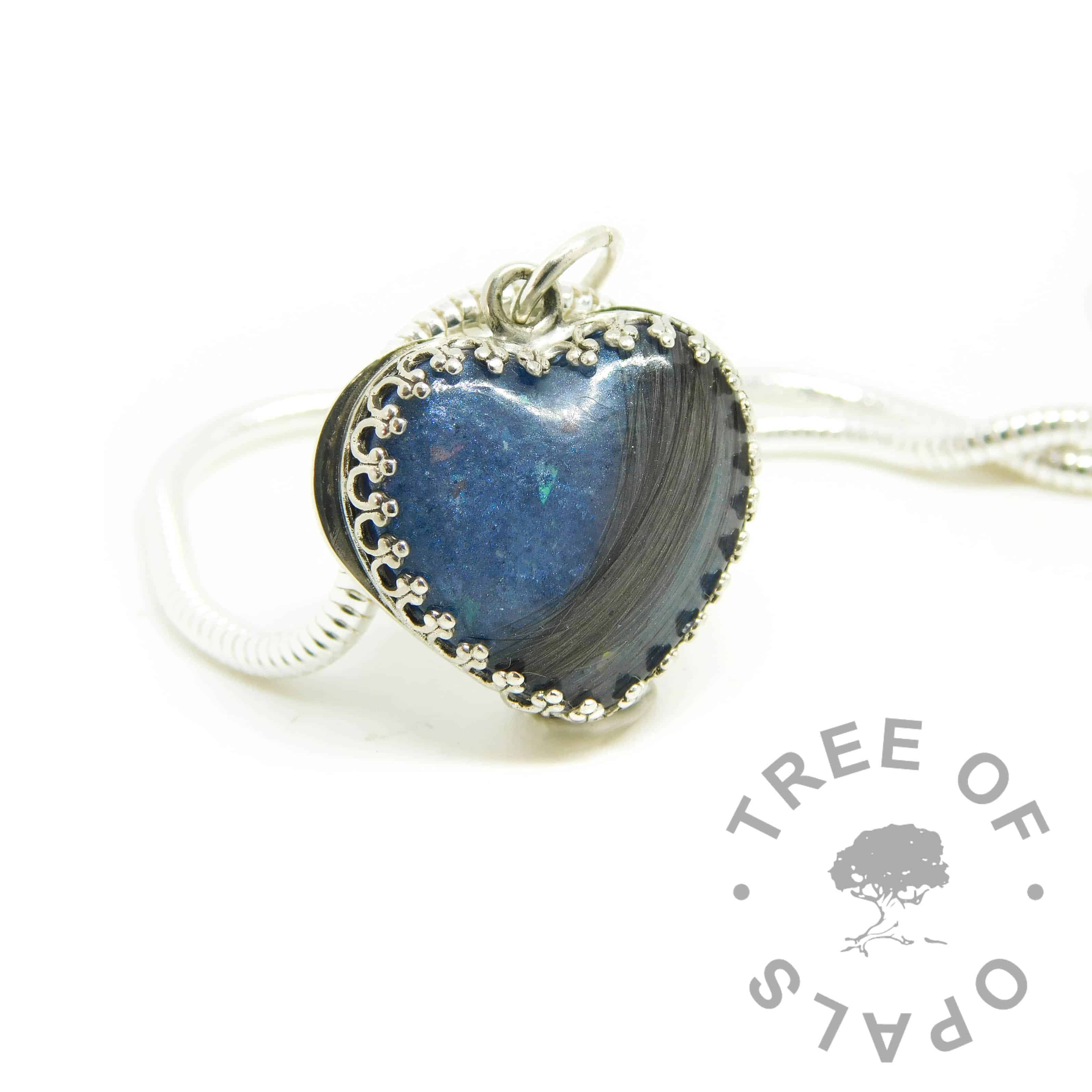blue hair heart with brown hair with some grey strands. Aegean blue resin sparkle mix