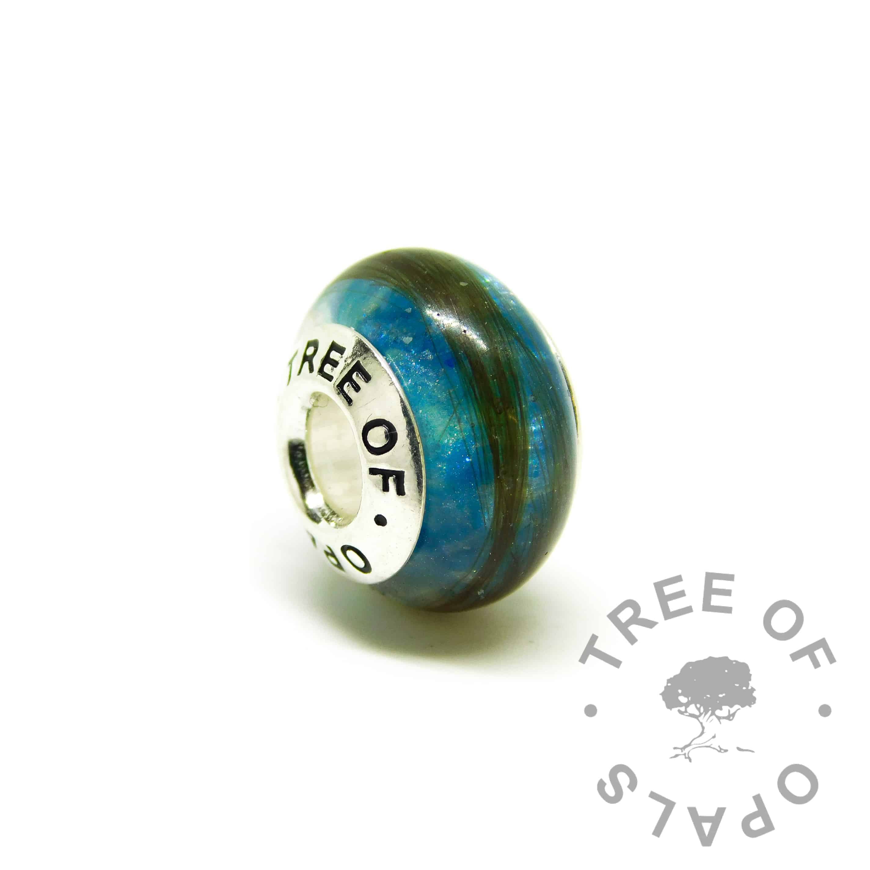 hair jewellery blue charm, strawberry blonde hair with Aegean blue resin sparkle mix. Tree of Opals branded core charm bead fits on Pandora bracelets