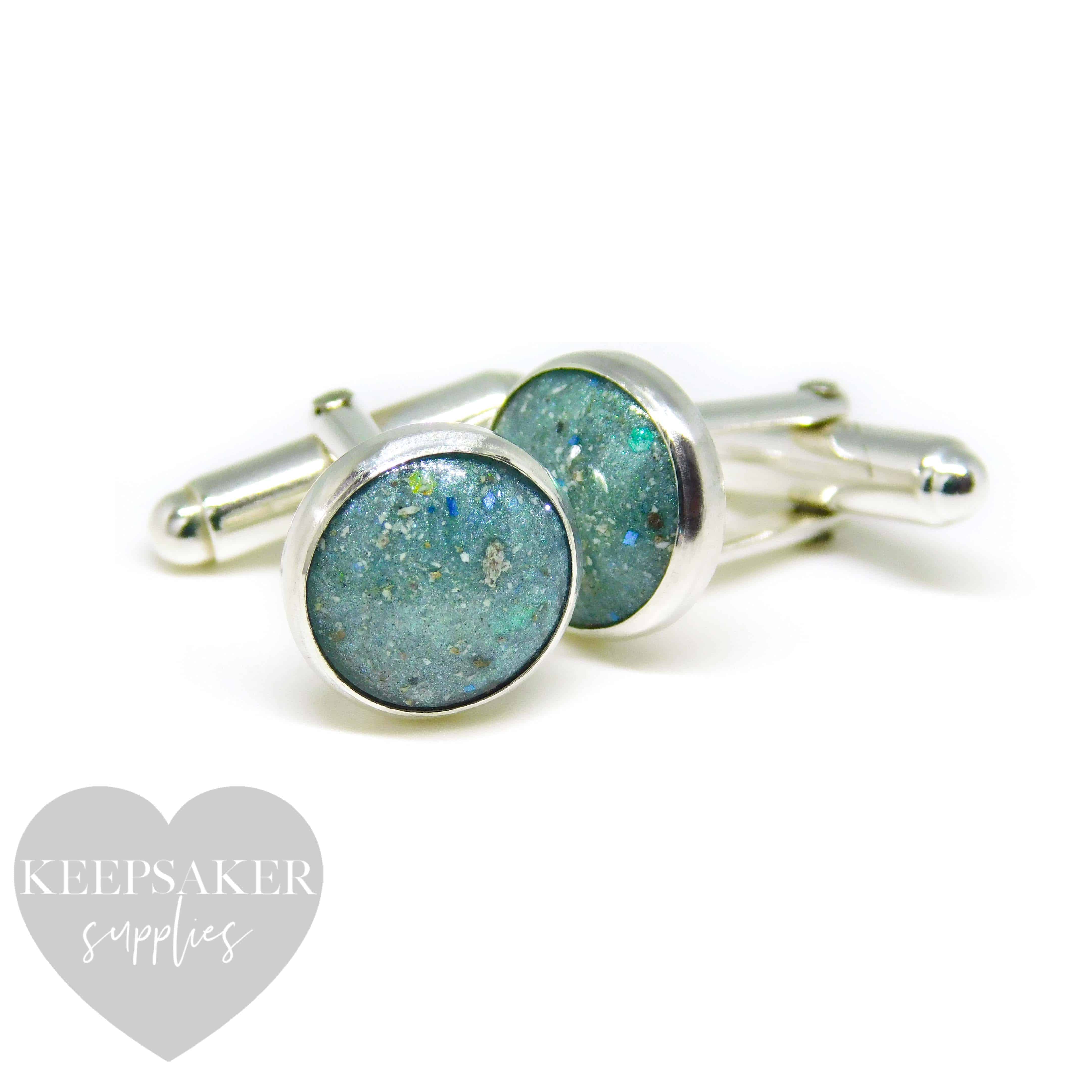 cremation ash cufflinks with mermaid teal resin sparkle mix. Handmade 12mm cabochon rubover bezel set cufflinks in solid sterling silver with cremation ashes