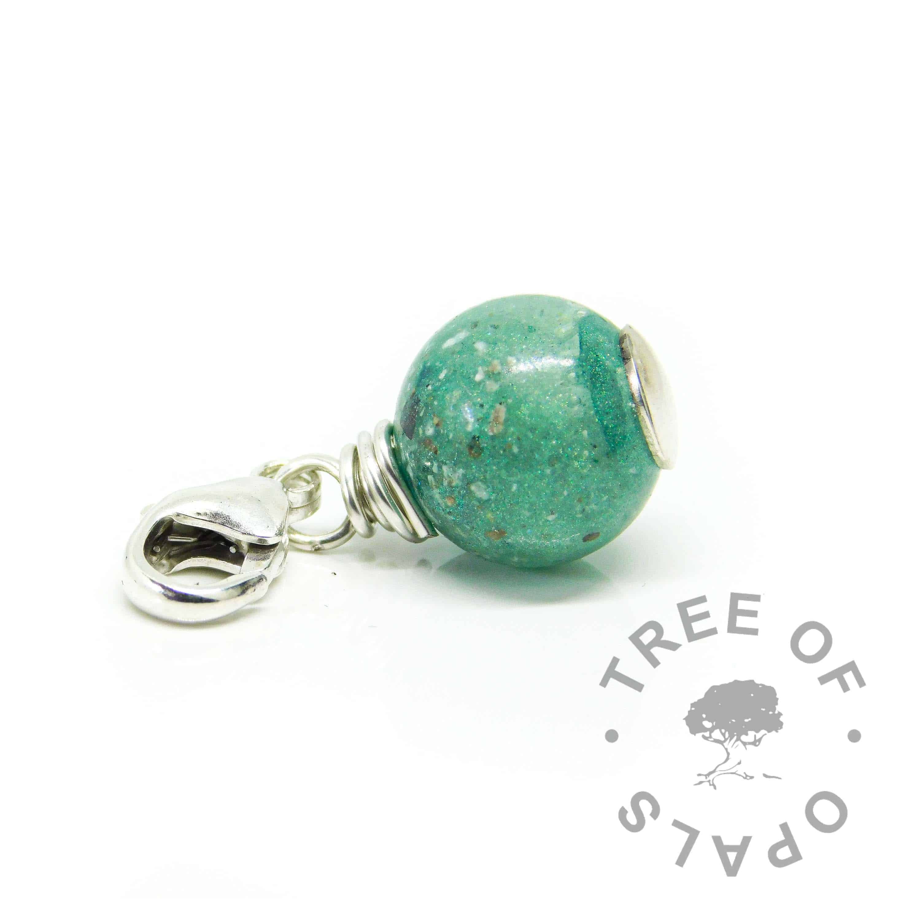 ashes orb teal. Mermaid teal resin sparkle mix with cremation ashes, solid silver wire wrapped setting with lobster clasp dangle charm setting