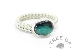 Hair ring on bubble band with mermaid teal resin sparkle mix, shown with bubble band stacking ring