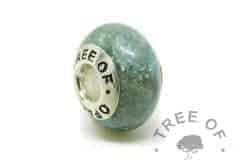 Cremation ash charm. Cremation ashes with mermaid teal resin sparkle mix,no birthstone. Set with solid sterling silver Tree of Opals core for Chamilia and Pandora bracelets. Watermarked copyright image by Tree of Opals
