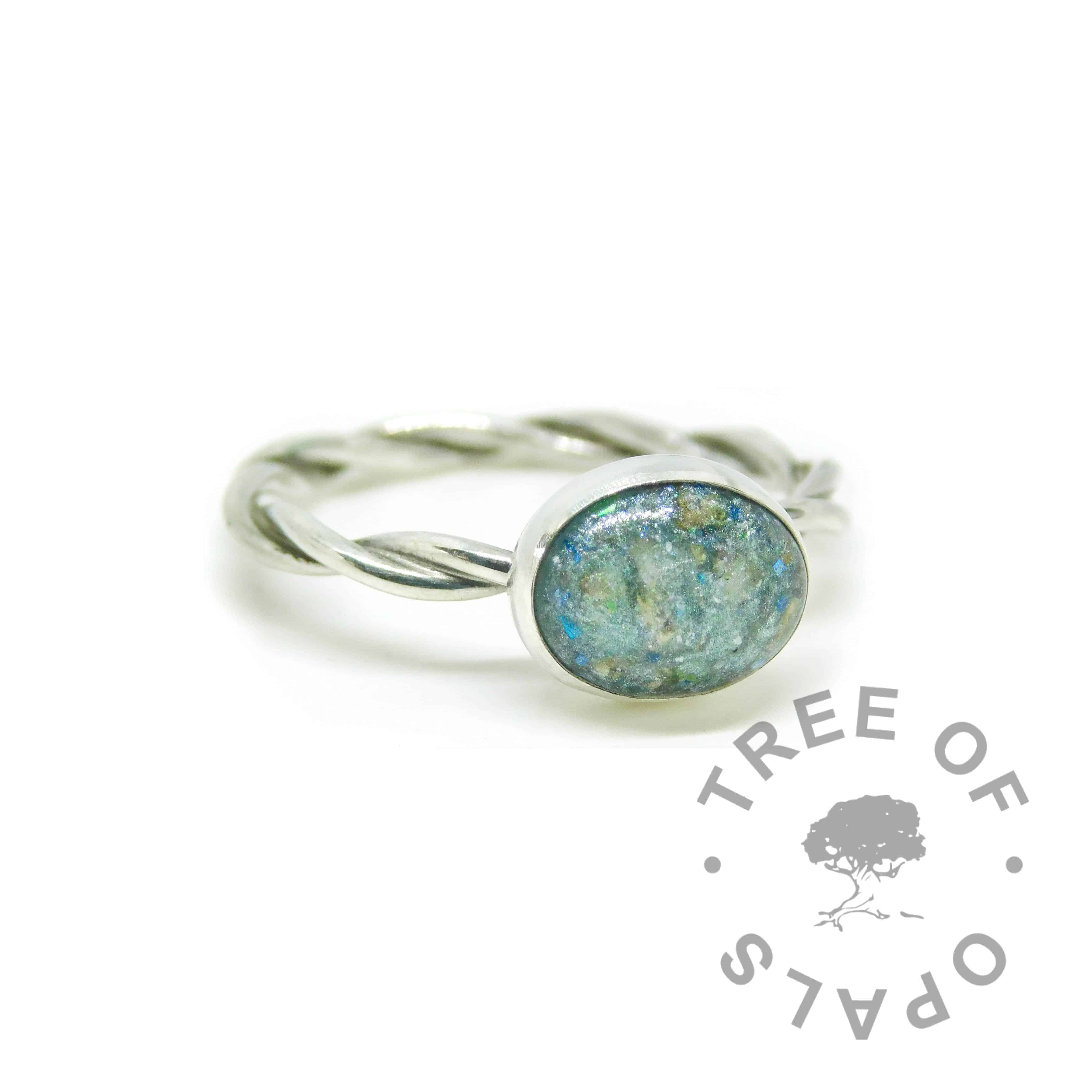 Remade from broken ring by another jeweller. Mermaid teal cremation ash ring on twisted wire band with textured stacking ring (umbilical cord ring). Solid sterling EcoSilver handmade ring. 10x8mm bezel cup rubbed over the cabochon for security.