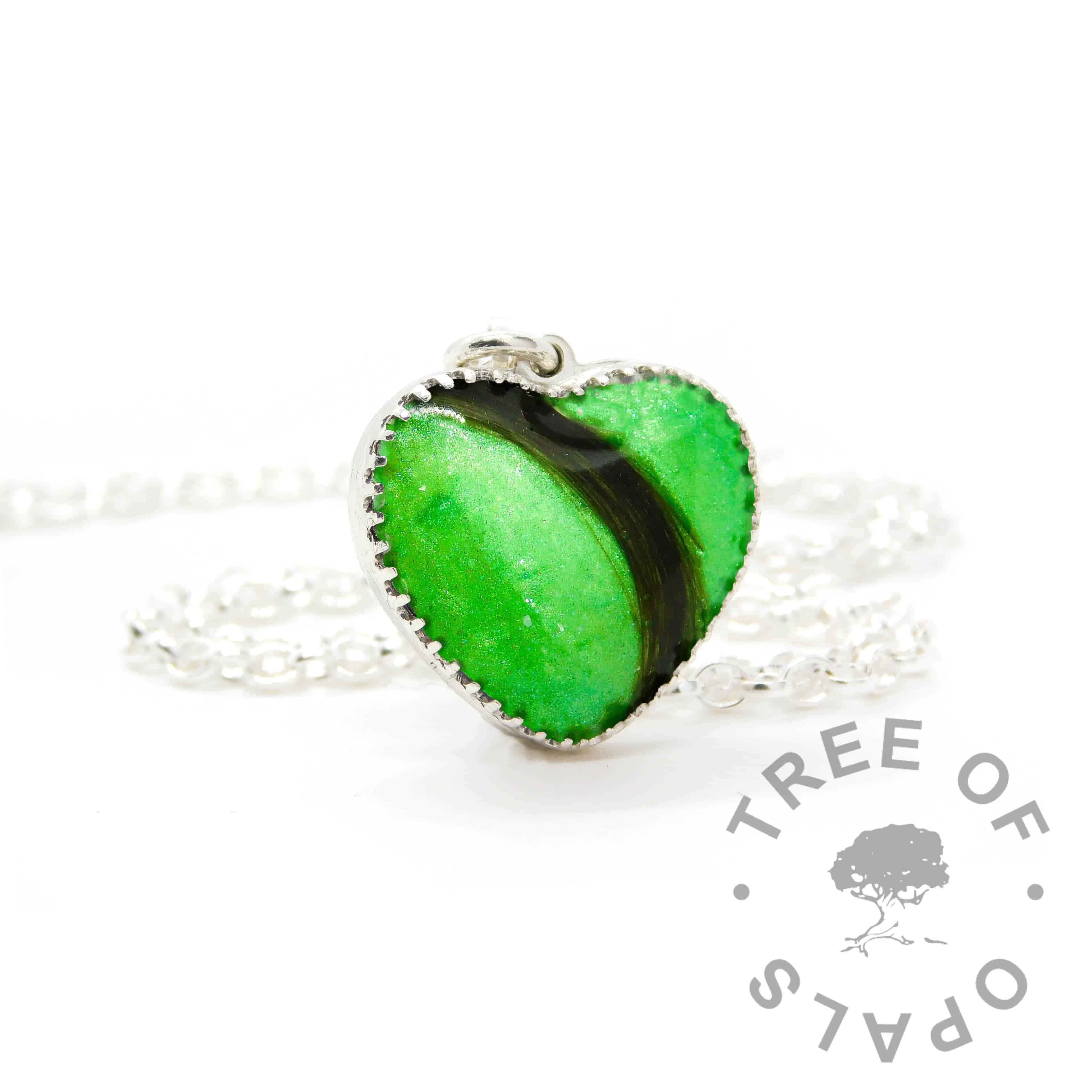 New style heart necklace setting with scalloped edge. Basilisk green resin sparkle mix, lock of hair, shown with a medium classic chain upgrade (mockup of new setting)
