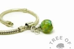basilisk green lock of hair pearl with European charm setting for Pandora bracelets. Shown on a bracelet