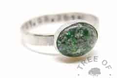 Emerald (May birthstone) ring with parakeet green glitter. Brushed band and date of birth stamping (mockup)