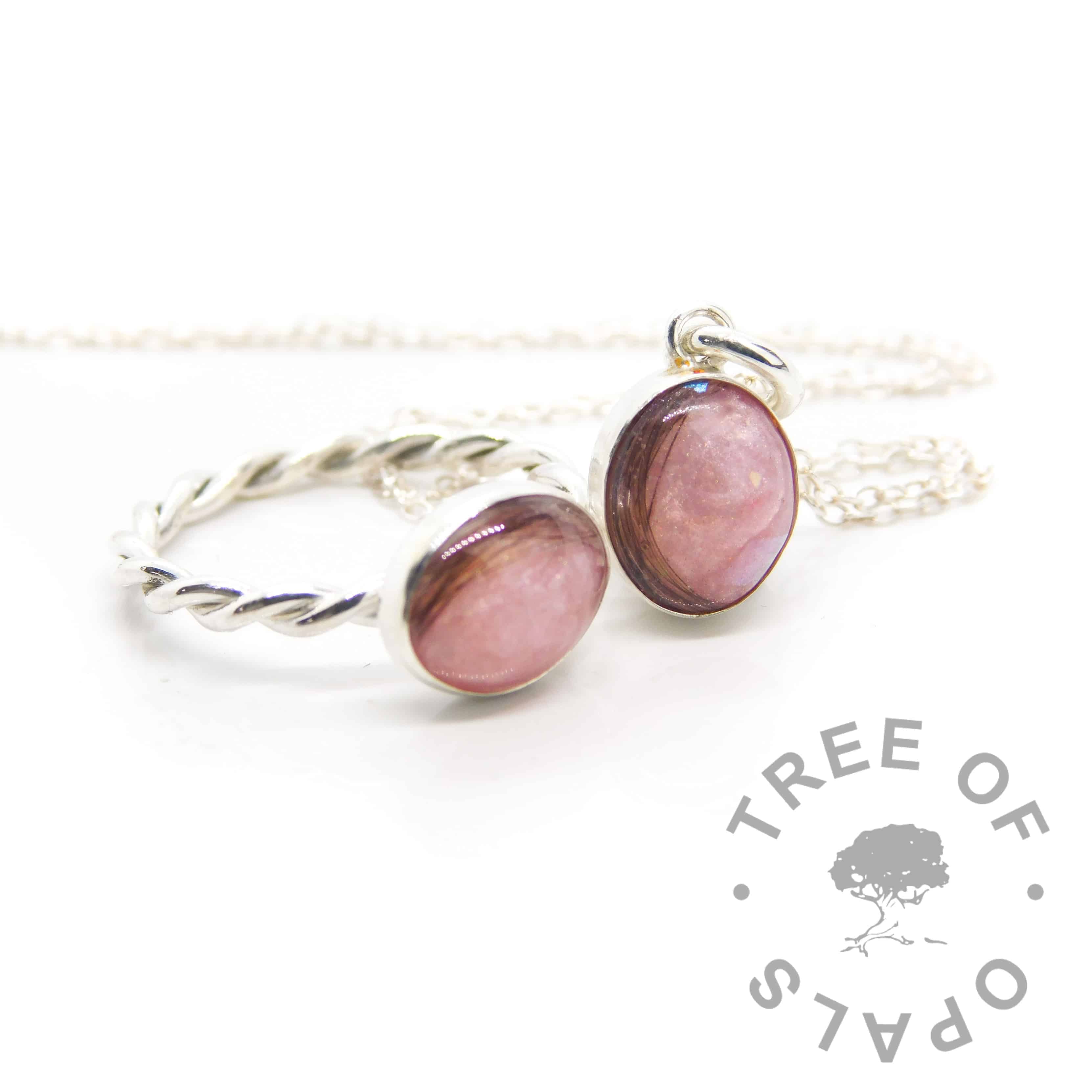 pink lock of hair necklace in asolid sterling silver, made as a mystery piece to accompany the pictured twisted band ring