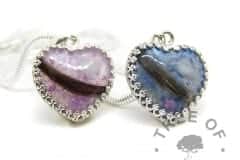 lock of hair heart necklaces with aquamarine March birthstone, Aegean blue and orchid purple resin sparkle mixes. 18mm heart with solid sterling silver crown point setting. Shown with wide snake chain upgrade. Copyright watermarked image