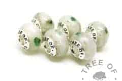 six cremation ash charms set with unicorn white resin sparkle mix and May birthstone rough natural emerald