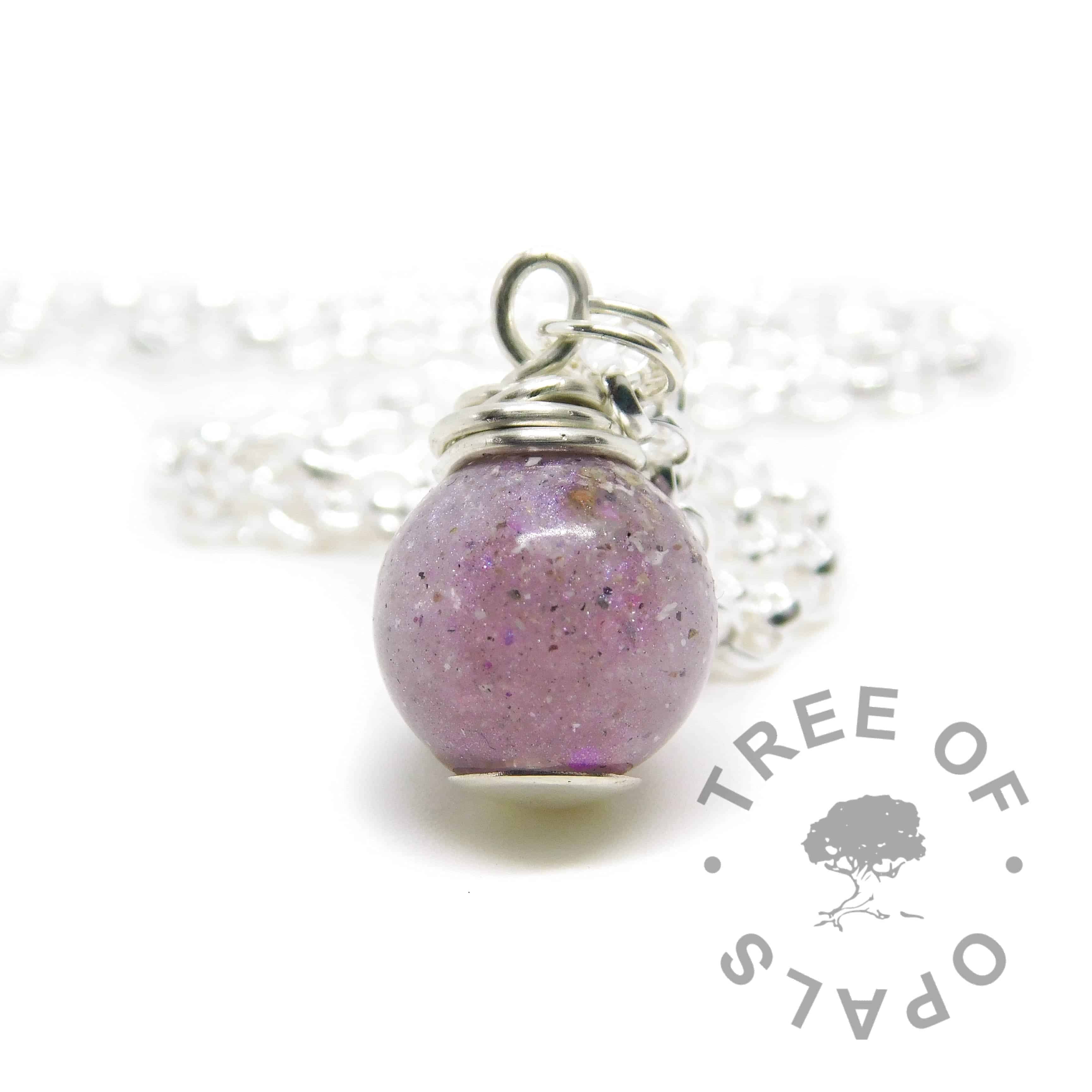 cremation ash pearl. Cremains with orchid purple resin sparkle mix, no birthstone. Set with solid sterling handmade headpin and shown with a medium classic chain necklace upgrade. Watermarked copyright image by Tree of Opals