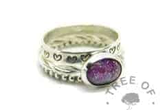 cremation ash ring with orchid purple and fairy pink resin sparkle mixes swirled together, no birthstone. Handmade twisted band EcoSilver ring shank, 10x8mm bezel cup. Shown with heart stamped and bubble wire stacking rings. Watermarked copyright Tree of Opals memorial jewellery image