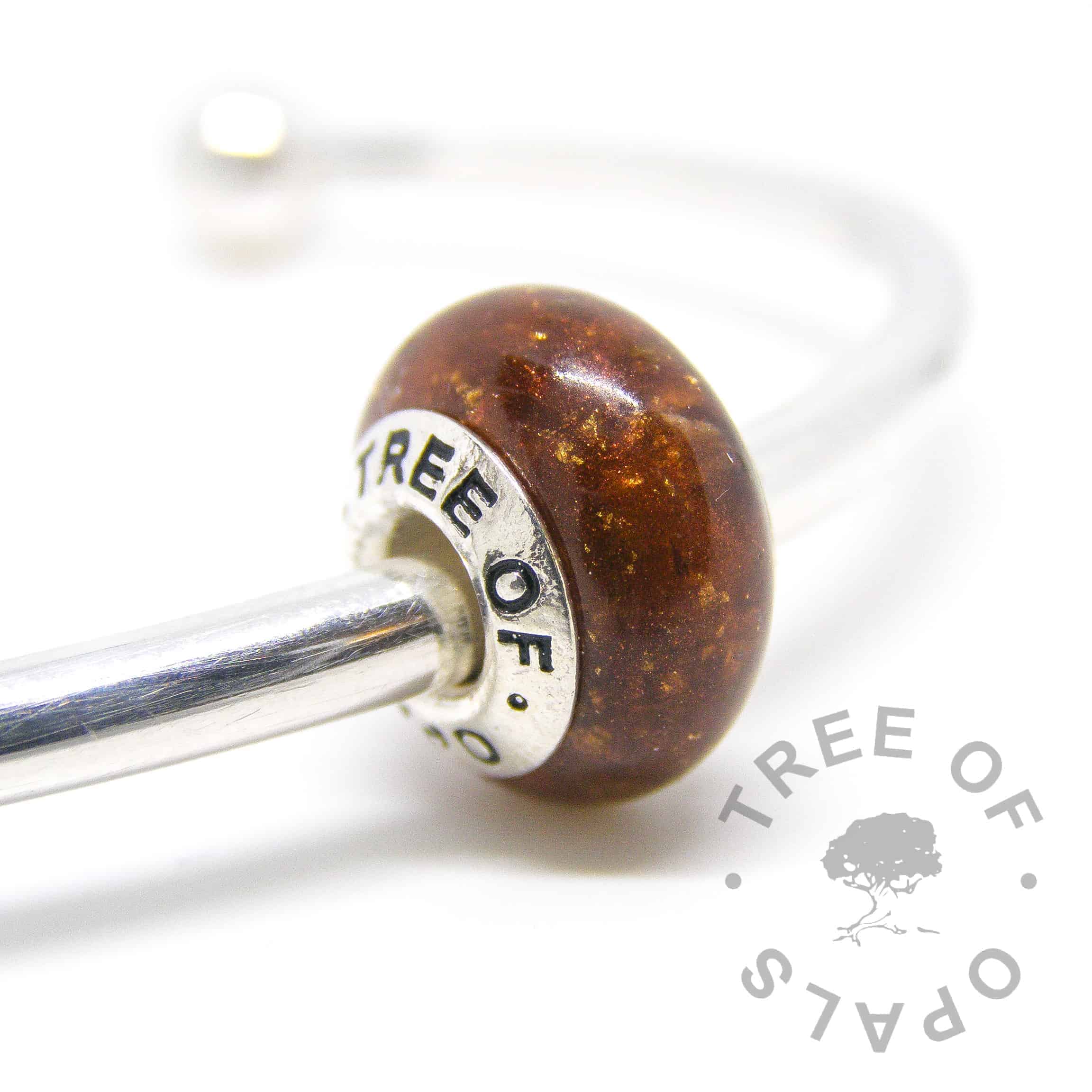 umbilical cord placenta bead in resin, genuine rose gold leaf and bronze shimmer with a solid sterling silver Tree of Opals branded core umbilical cord charm