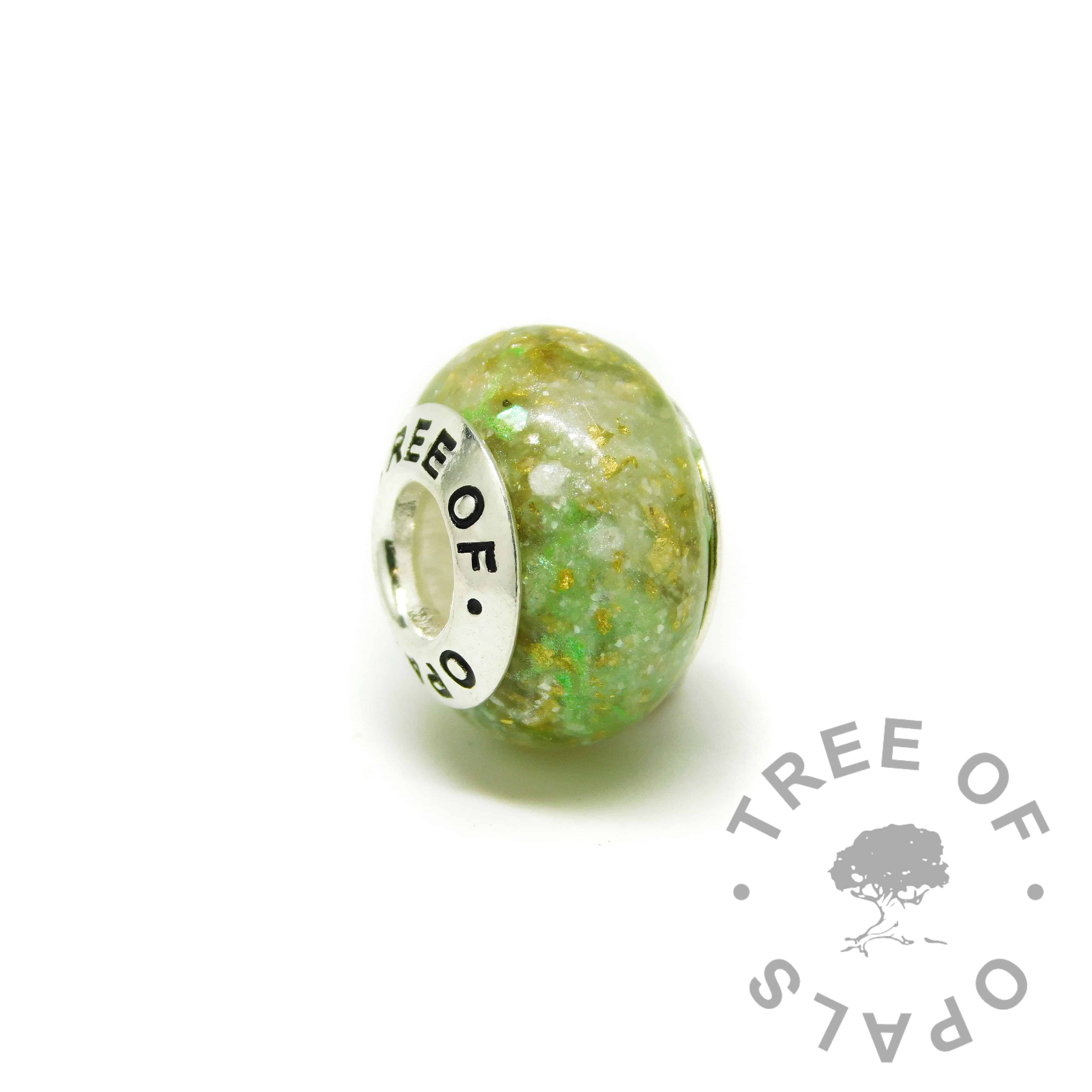 ashes charm with Tree of Opals core, basilisk green resin sparkle mix and subtle gold leaf. cremation ashes charm bead