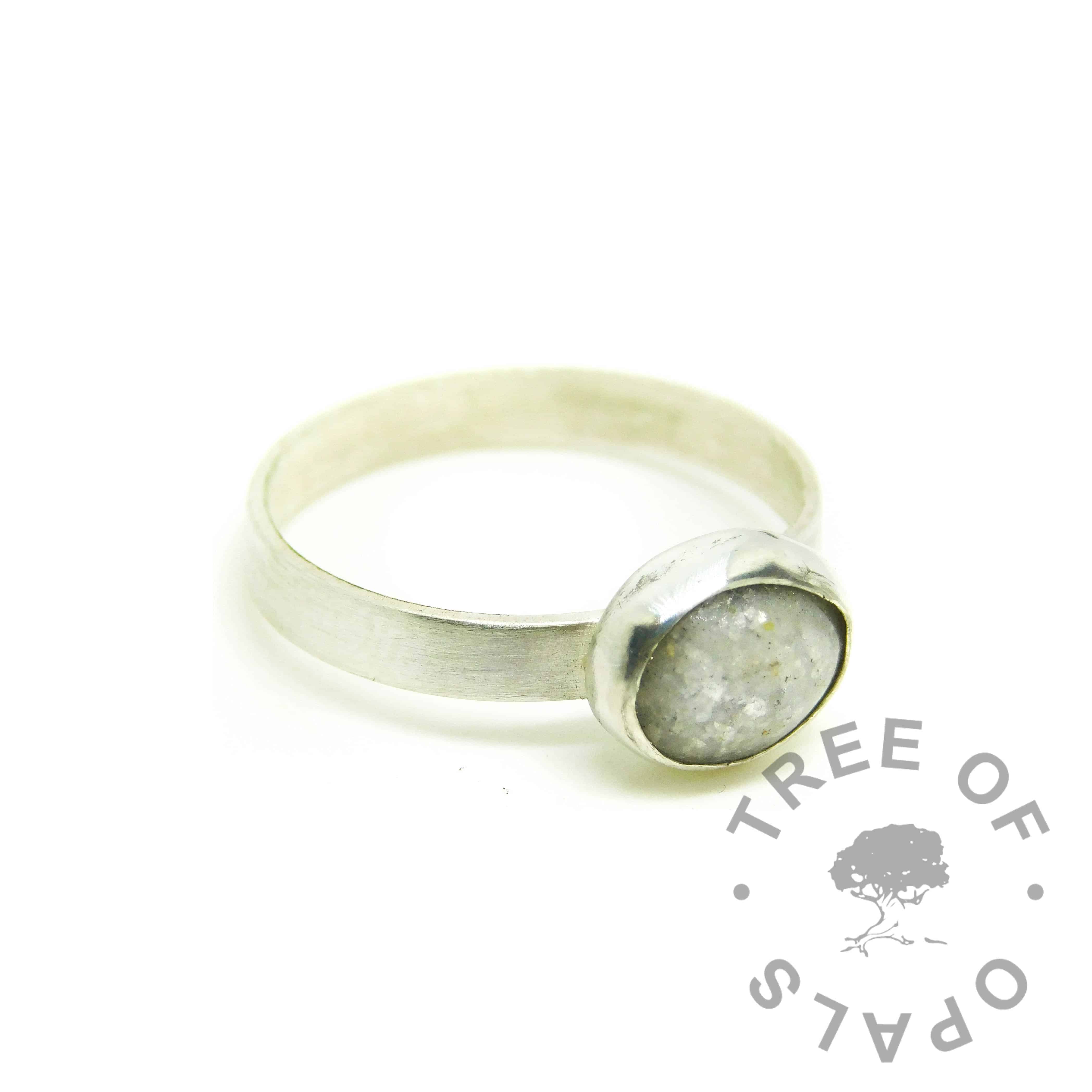 cremation ash ring with unicorn white resin sparkle mix and silver leaf on brushed band