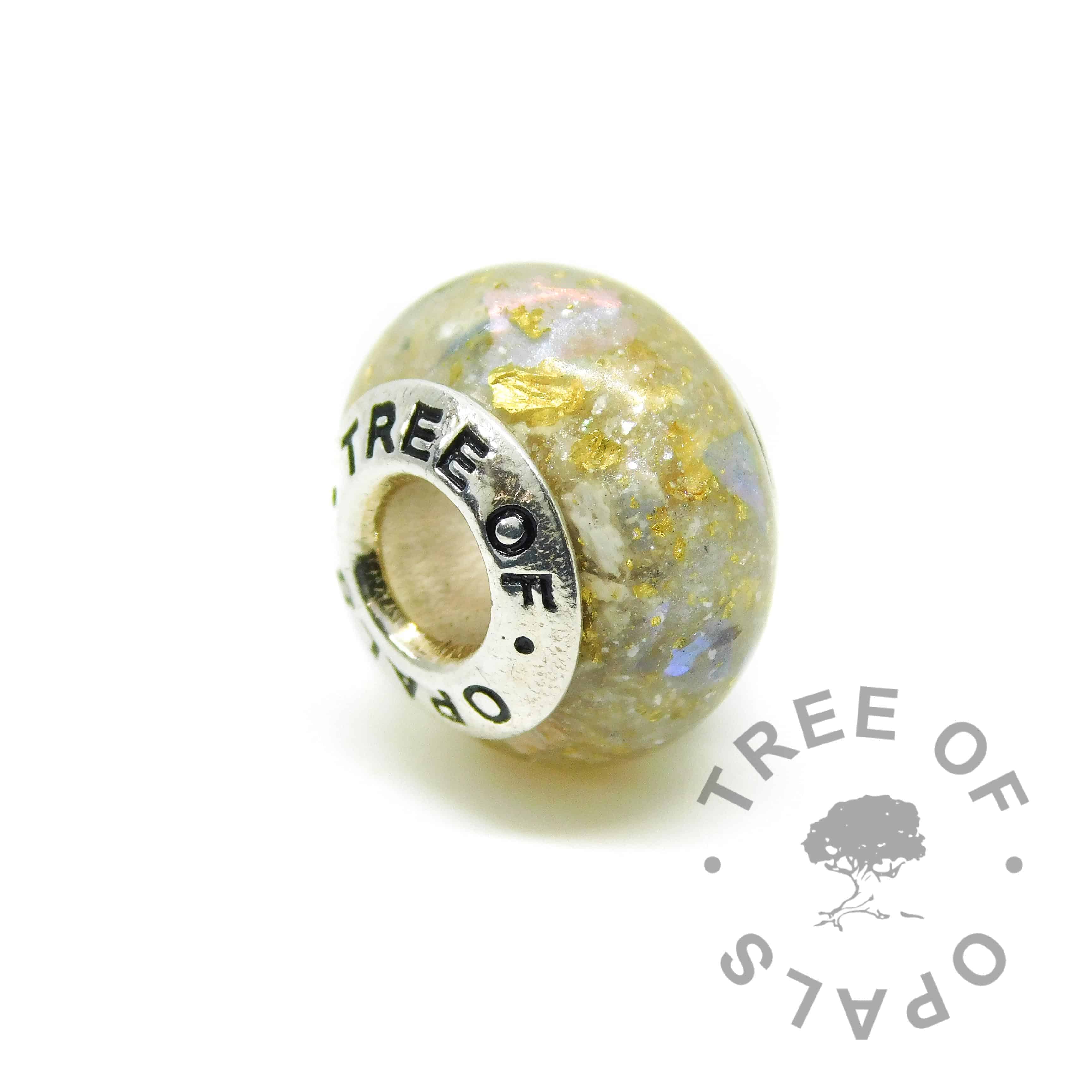 unicorn white cremation ash charm with a little blue opalescent and thick genuine 22ct gold leaf  (special request, just ask in comments)