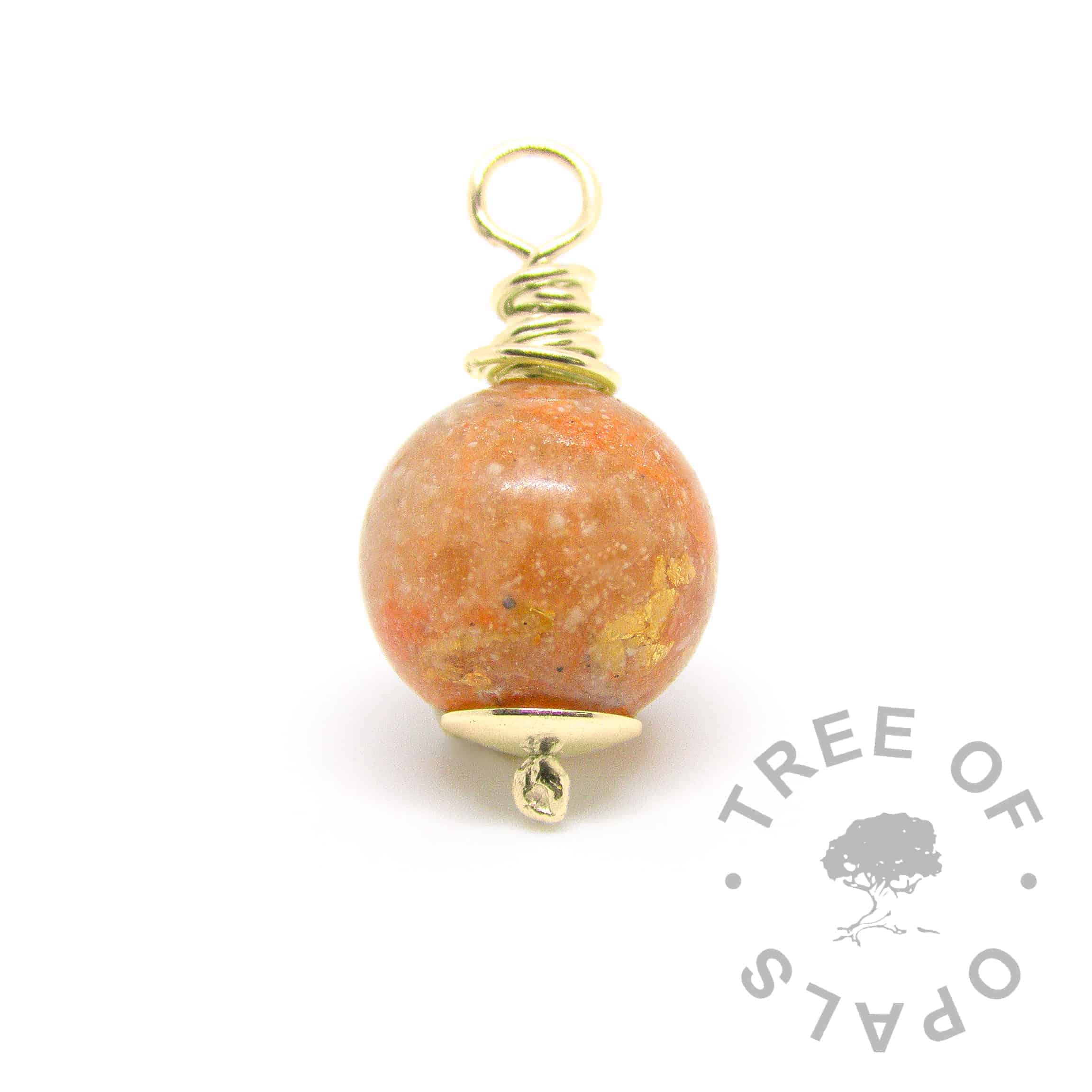 gold cremation ash pearl with yellow topaz December birthstone with tangerine orange shimmer
