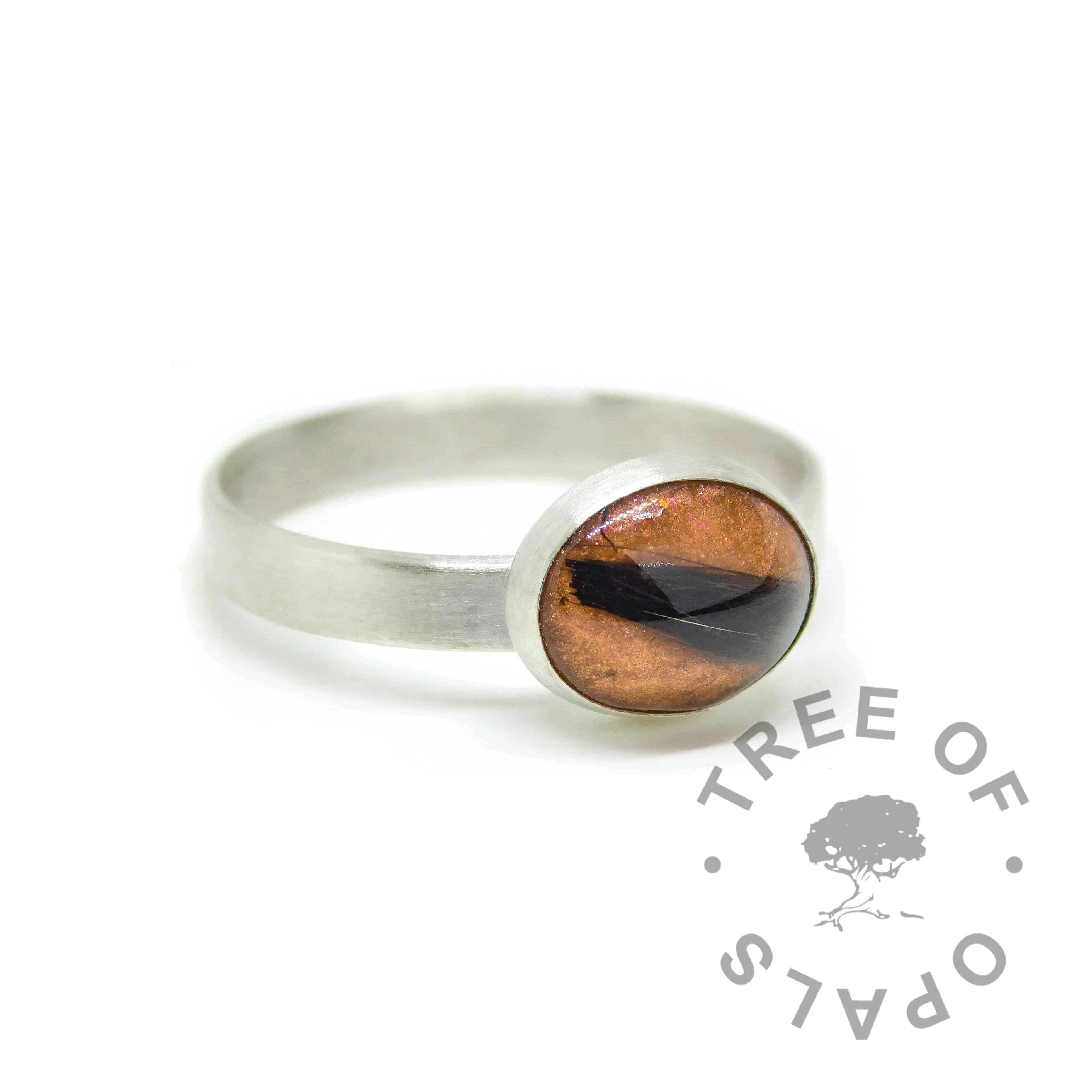 Tangerine orange lock of hair ring on brushed wire band. Solid sterling EcoSilver handmade ring. 10x8mm bezel cup rubbed over the cabochon for security.
