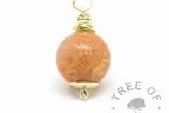 gold cremation ash pearl with yellow topaz December birthstone with tangerine orange shimmer