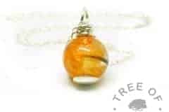 tangerine orange lock of hair pearl with smooth base and wire wrapped necklace setting
