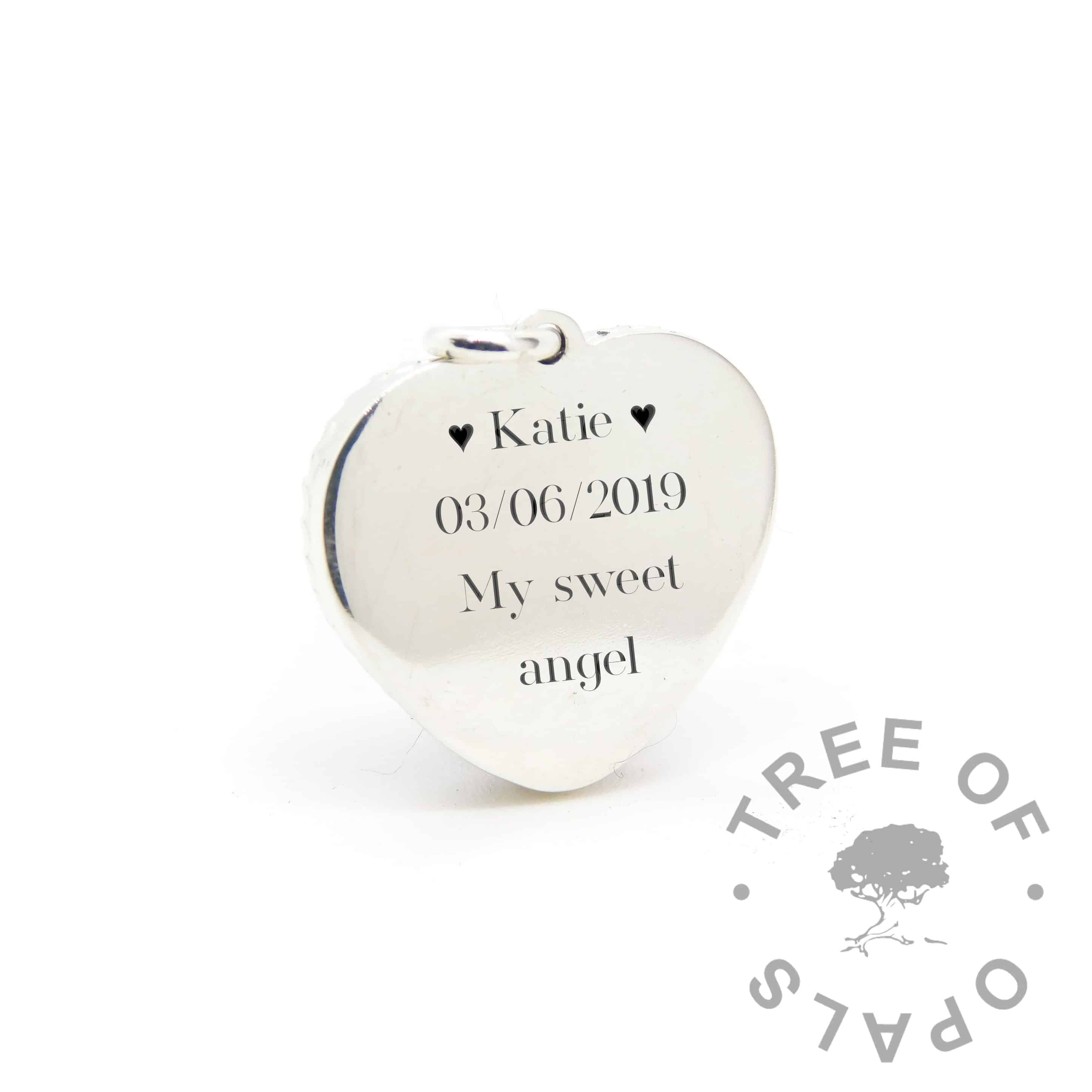 New style heart necklace setting back, with Silver South Serif font and heart emojis engraving mockup (shown without necklace chain)