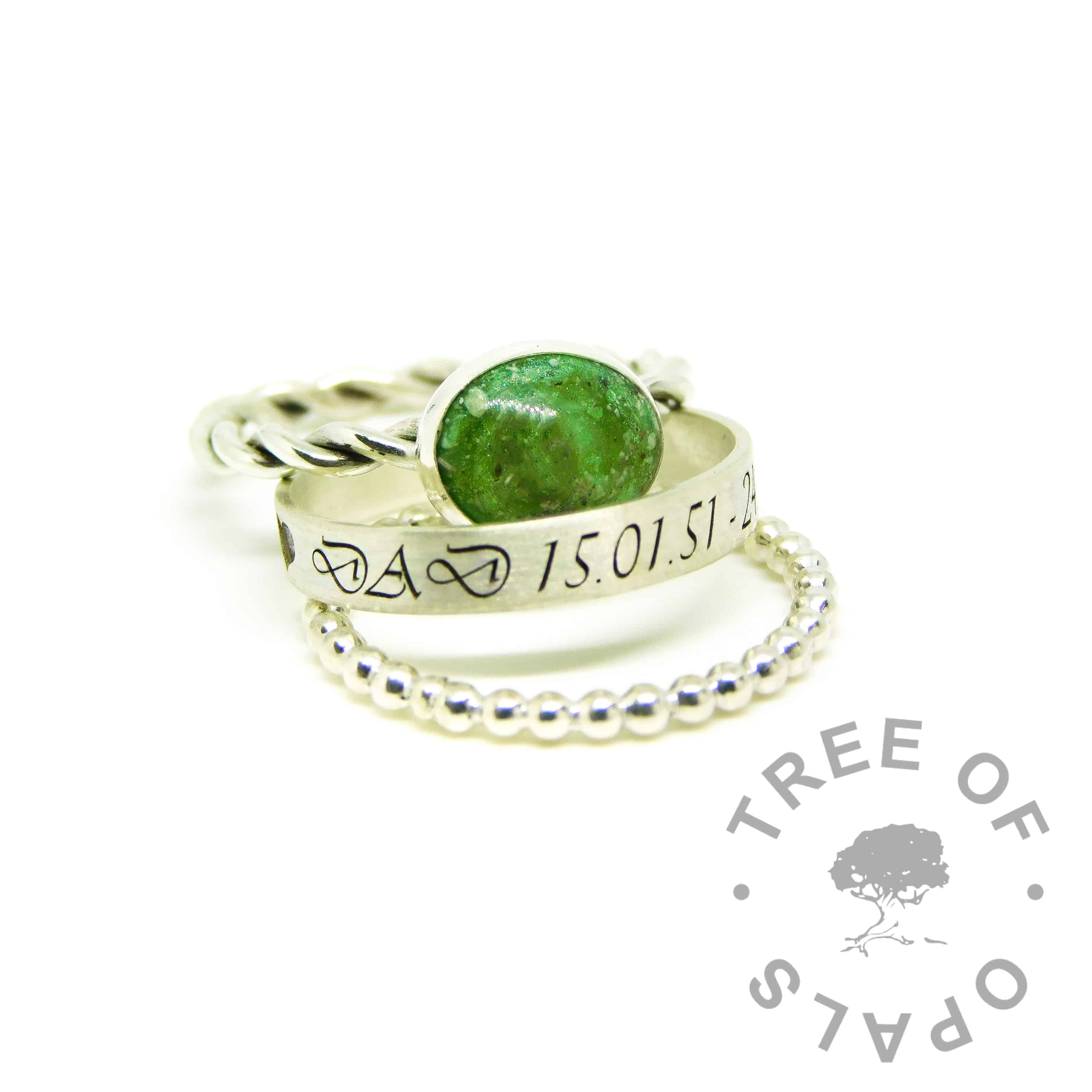 ashes jewellery rings, engraved 3mm brushed band with allcaps Vivaldi font on the outside of the band, bubble wire stacking ring, basilisk green resin ashes ring on twisted wire band