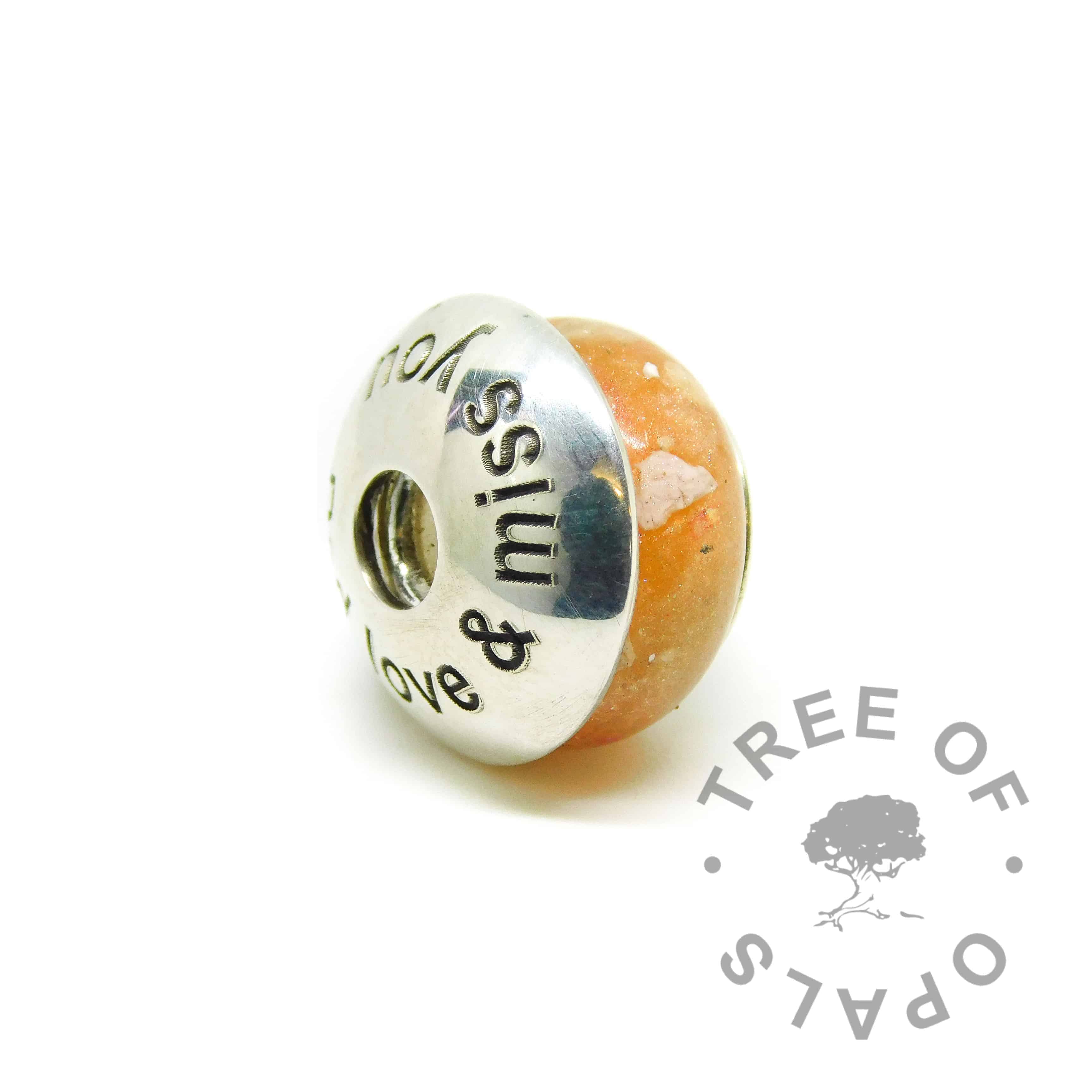 tangerine orange cremation ash charm shown with charm washer Arial font with Dad love & miss you. Sold separately