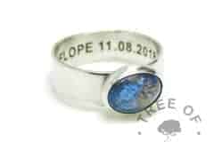 Aegean blue umbilical cord ring on 6mm shiny band. Solid 925 sterling EcoSilver handmade ring with engraved text on the inside of the band, in Arial font. 10x8mm bezel cup rubbed over the cabochon for security.