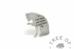 cat necklace pendant engraved with "Cats leave paw prints on your heart" and double paw print emoji. Engravable cat licking its paw shape, solid eco Argentium silver (mockup)