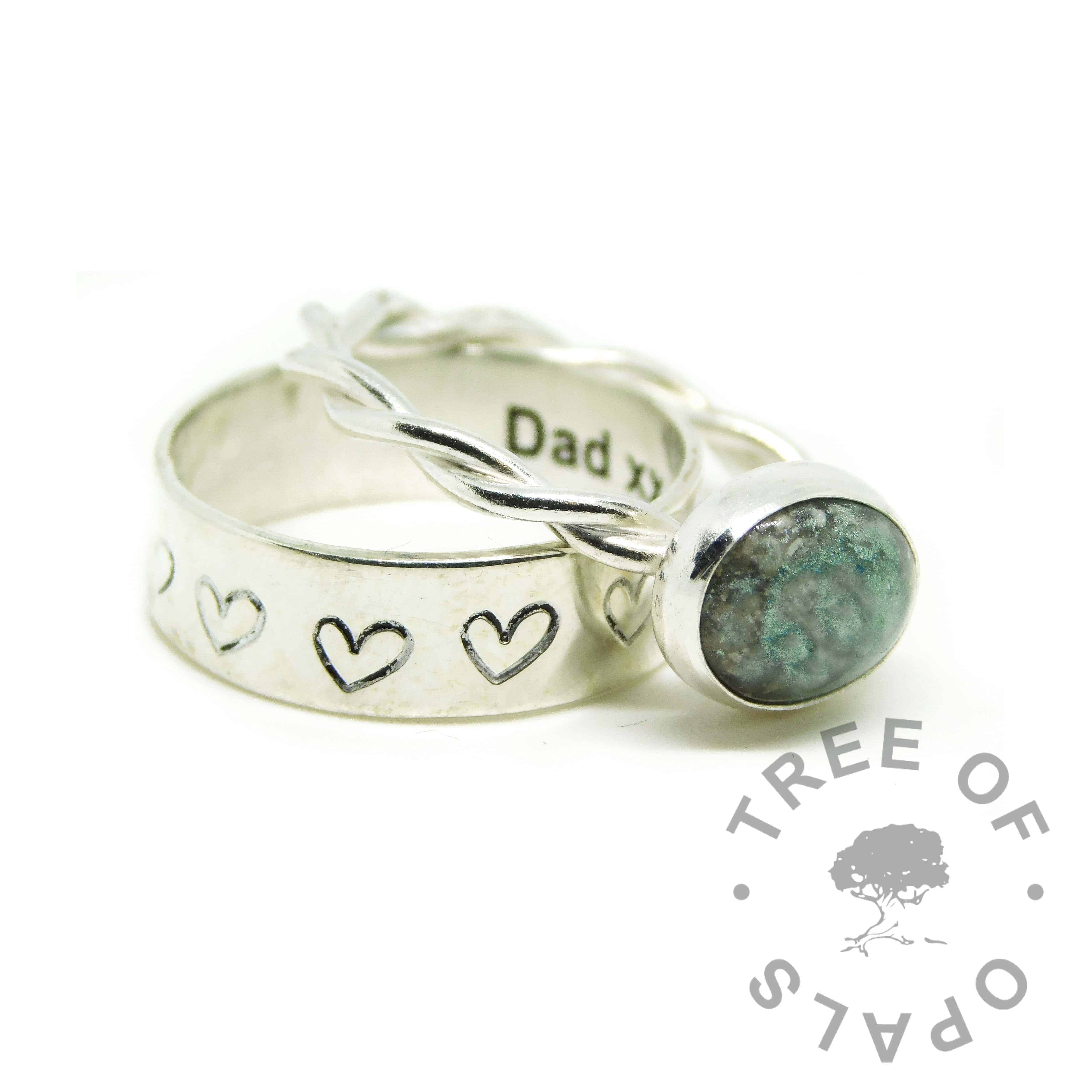 aqua ashes ring, cremation ashes ring on twisted band. Angelic aqua resin sparkle mix. Shown with a heart handstamped 6mm band stacking ring, engraved Dad xx inside