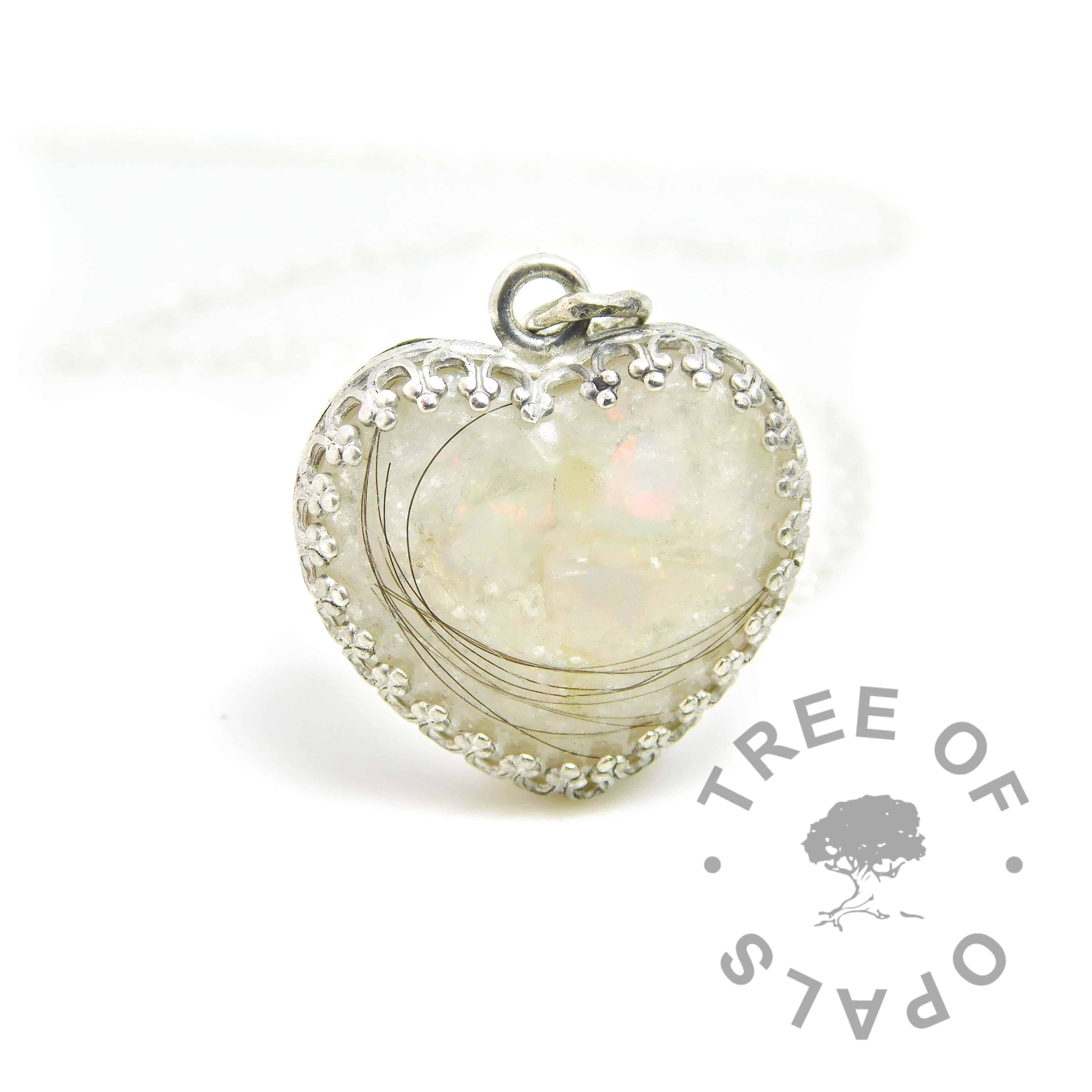 Lock of hair heart necklace with unicorn white resin sparkle mix, rough natural opal slices October birthstone. Solid sterling silver 20mm crown point heart setting (925 stamped on the back). Lightweight classic necklace chain included. Watermarked copyright Tree of Opals memorial jewellery image