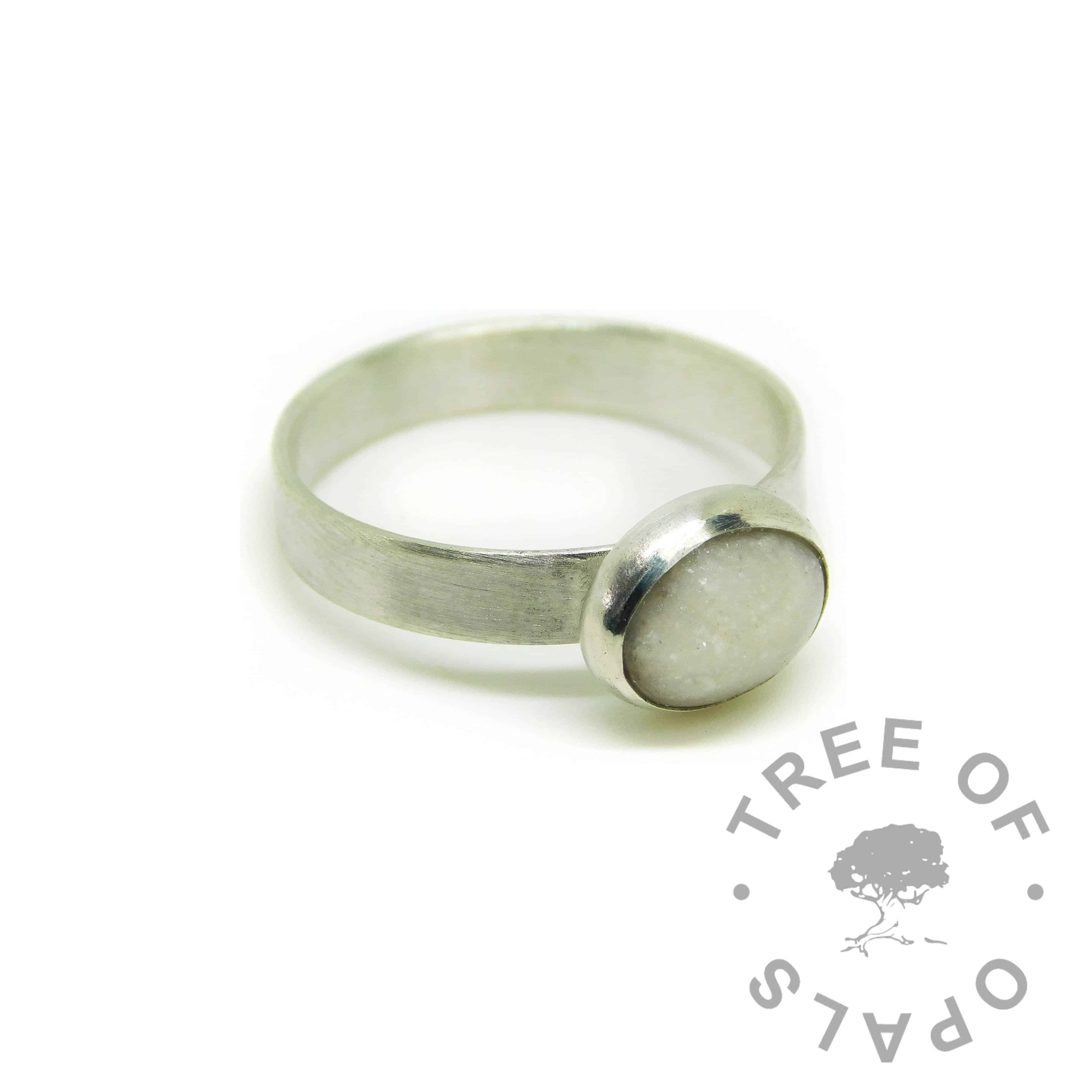 Cremation ash ring with unicorn white resin sparkle mix. Brushed band ring solid sterling EcoSilver