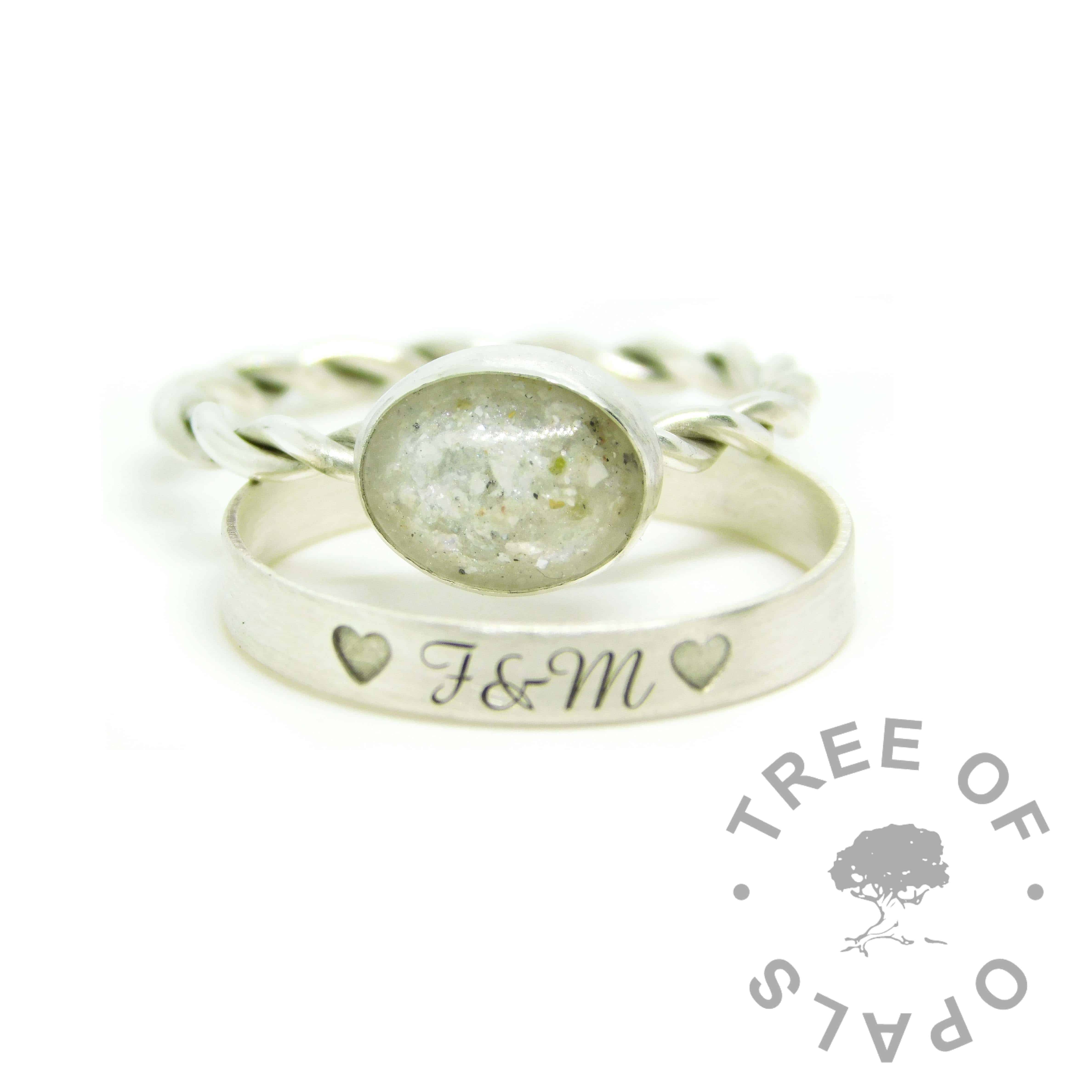 white ashes ring, cremation ashes ring on twisted band. Unicorn white resin sparkle mix, naturally light ashes. Engraved wide band brushed stacking ring, outside in Amazone BT font