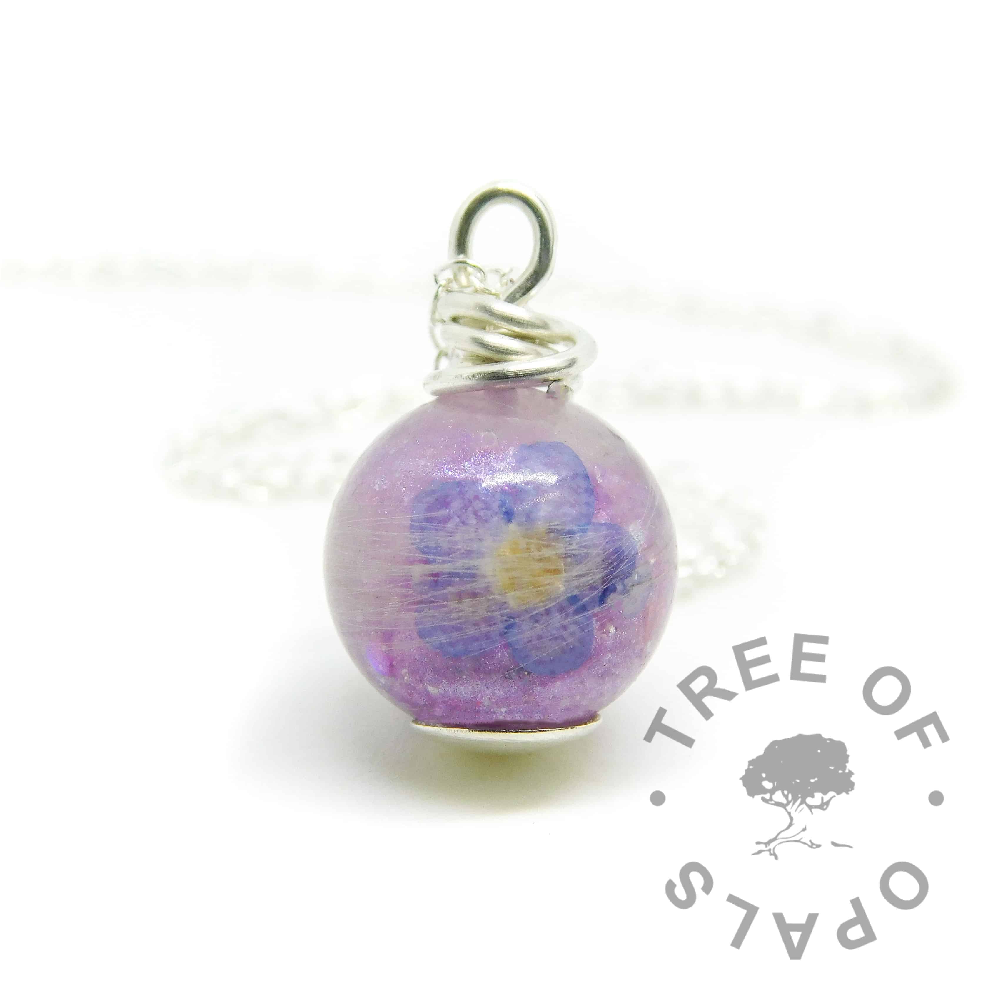 forget me not lock of hair pearl with naturally grey white hair, orchid purple resin sparkle mix in an 11mm sphere. Flat base, solid sterling silver wire wrapped by hand shown with matinee length lightweight chain