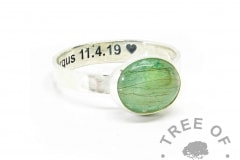 Fur ring on 3mm textured band with basilisk green resin sparkle mix. Engraved inside in arial font with heart emoji. Much of the fur is translucent and can't be seen, we only see the darker strands