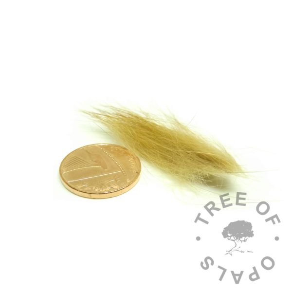 ideal fur amount with penny for scale. This is enough fur to make around two orbs, charms or rings