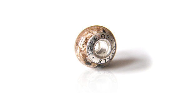classic clear resin cremation ash charm bead with Tree of Opals signature solid sterling silver core