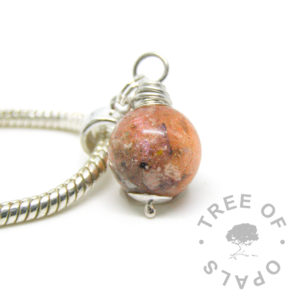 cremation ash pearl with tangerine orange sparkles and opal on a European dangle charm setting for Pandora bracelets shown on a 3mm wide snake chain bracelet upgrade or necklace upgrade. Pearl and chain sold seperately