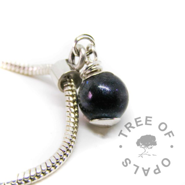 lock of hair pearl vampire black resin sparkle mix and black fur, wire wrapped by hand in solid sterling silver and set as a European dangle charm for Chamilia and Pandora bracelets. Shown on a 3mm snake chain. Please note that pearls are now made with a flat base which is attached to a headpin for extra security, they no longer have the silver dot at the bottom.