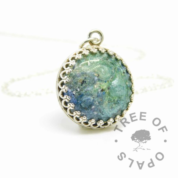 teal ash mystery memorial jewellery, 16mm crown point necklace with mermaid teal, basilisk green and Aegean blue sparkle mix and cremation ashes