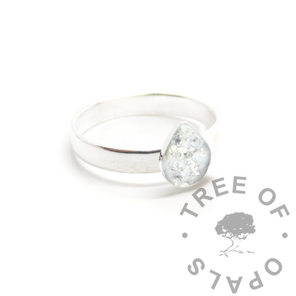 Breastmilk Teardrop Ring wide satin band 8x6mm teardrop bezel ring setting with direct pour or filled set breastmilk with lots of silver leaf. Handmade solid silver keepsake, breastfeeding keepsake ring setting. Solid 940 anti-tarnish silver band and setting 925 solid silver. Digital mockup photo