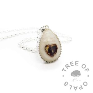 umbilical cord teardrop necklace Umbilical cord addition Nikki's own necklace! Unicorn white sparkle mix and breastmilk teardrop necklace, with a classic umbilical heart inlay. Shown with a medium necklace chain upgrade. 935 high quality solid silver settings in anti-tarnish silver. Classic breastmilk jewellery, no colour or sparkle added