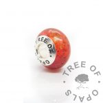 dragon's blood red cord bead - umbilical cord, red sparkle mix and clear resin in a medium bead mould with bead core (branded)