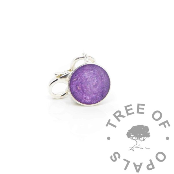 Cremation ashes little 8mm bezel cup, orchid purple resin sparkles. Solid silver tiny dangle charm with lobster clasp.