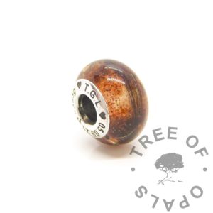 Blood Bead Umbilical cord and lock of hair bead with engraved core. Classic cord with no sparkles and flakes, stunning natural amber colour. Engraved with arial font and heart emojis