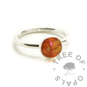Umbilical Cord Ring umbilical cord round ring classic band. Round wire ring setting, satin finish band. Engraved with arial font name and date of birth. Keepsake jewellery, 8mm round anti-tarnish silver setting. Cord with tangerine orange resin sparkle mix