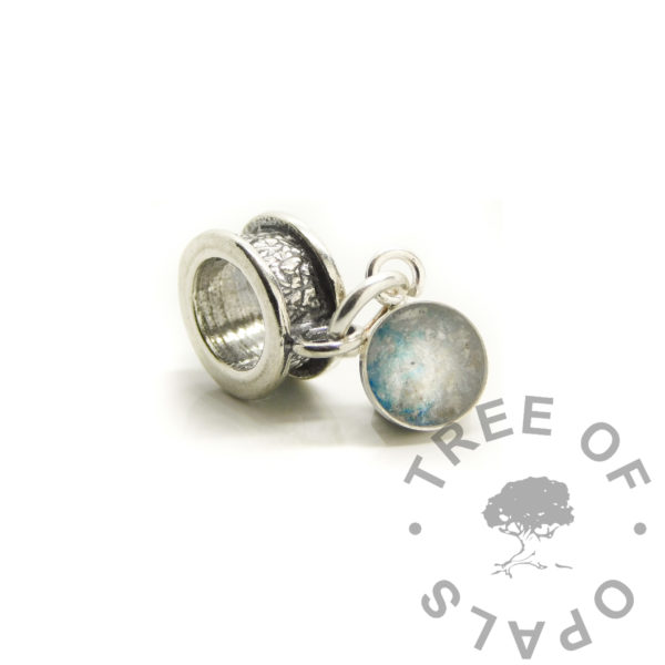 cremation ashes blue dangle charm. 6mm round dangle charm for European bracelets with channel dangle charm setting. Cremains with blue and pearlescent blue resin sparkle mixes