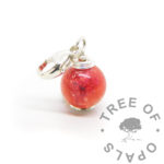 silver ashes orb with dragon's blood red resin sparkle mix, rose gold leaf and cremation ashes. Set with 935 solid silver headpin and 11mm carabiner clasp