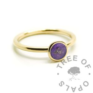 Gold Ayla Cremation Ashes Ring solid gold Ayla ashes ring with purple sparkles. 9ct yellow gold hallmarked, also available in rose gold and 18ct gold. Cast in Scotland and finished in Wales, hallmarked at the Birmingham Assay Office. Keepsake memorial rings with 9k real gold cremation ashes ring, orchid purple resin sparkle mix. Image mockup