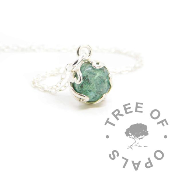 heartpoint teal ashes necklace, 8mm round stone with UV resin and naturally dark cremation ashes. Solid sterling silver setting on 1.3mm chain
