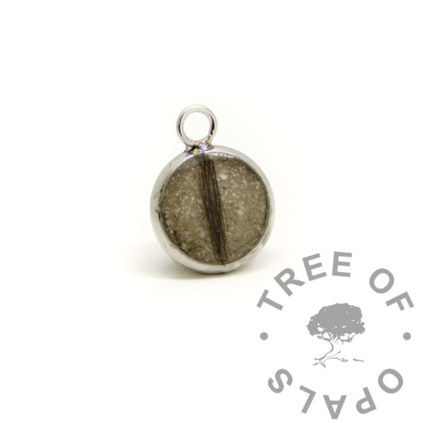 steel bezel mockup piece. With cremation ashes and lock of hair. Cremains and lock of hair jewellery without colour sparkle mix, classic. Handmade resin jewellery memento necklace piece to check client is happy with the colour. This piece is returned free of charge